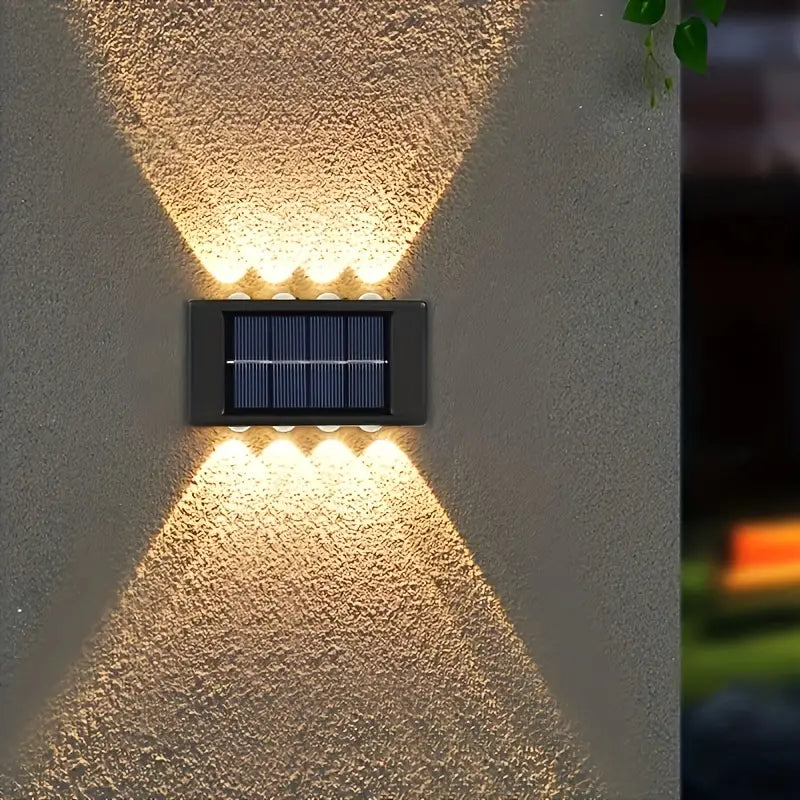 Solcellsdriven LED-utomhuslampa | Svart rostfritt stål | Modern design | För trädgård och terrass | Trådlös installation | 20 LED-lampor | Höjd 25 cm | Bredd 15 cm | Hållbar och snygg belysning